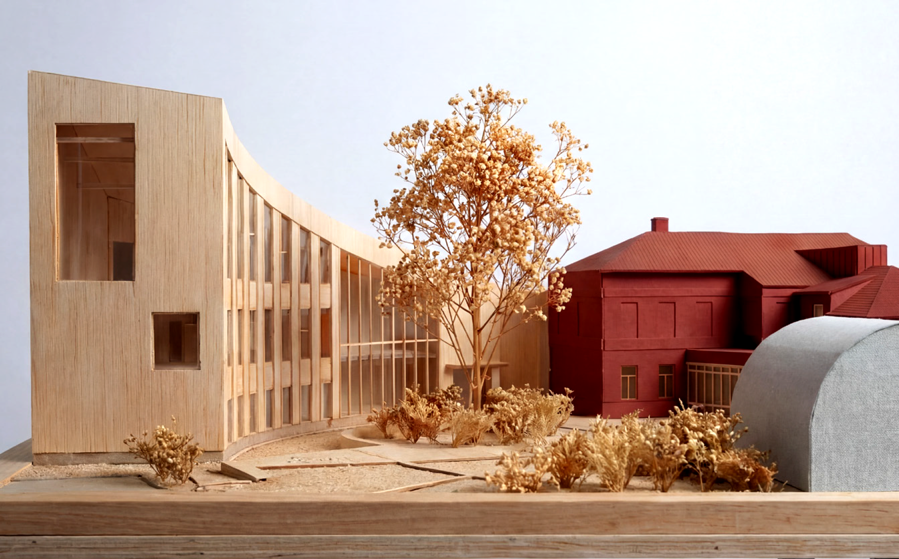 Illustration av ett hus med ett träd framför.